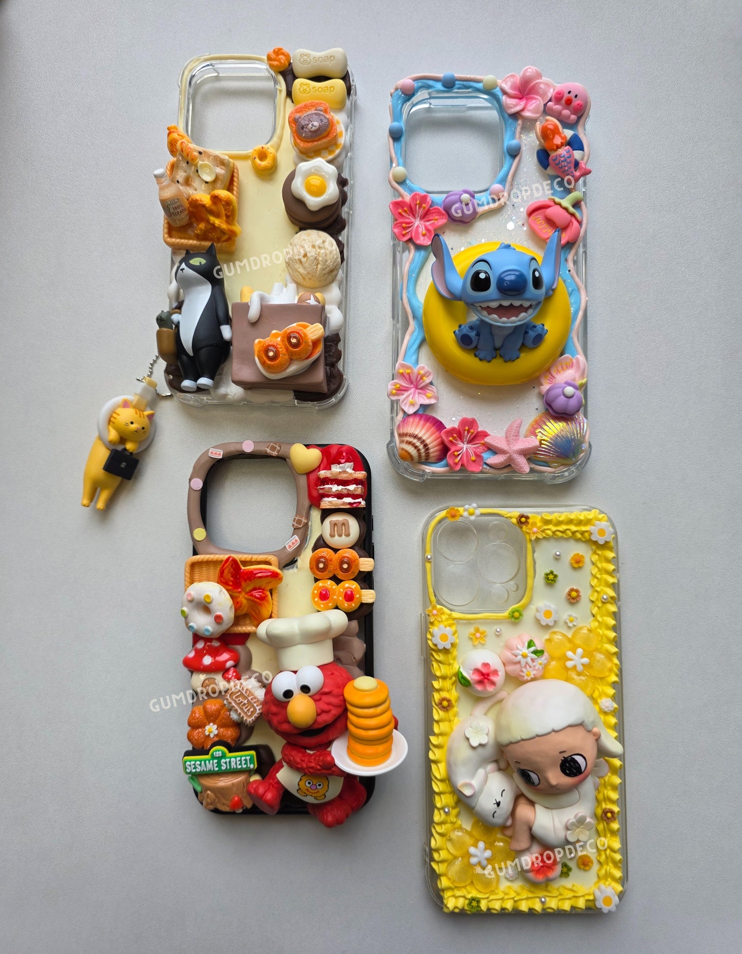 Custom decoden phone case featuring Top Toy & Pop Mart figurines. Handmade design, protective case & unique collectible accessory.