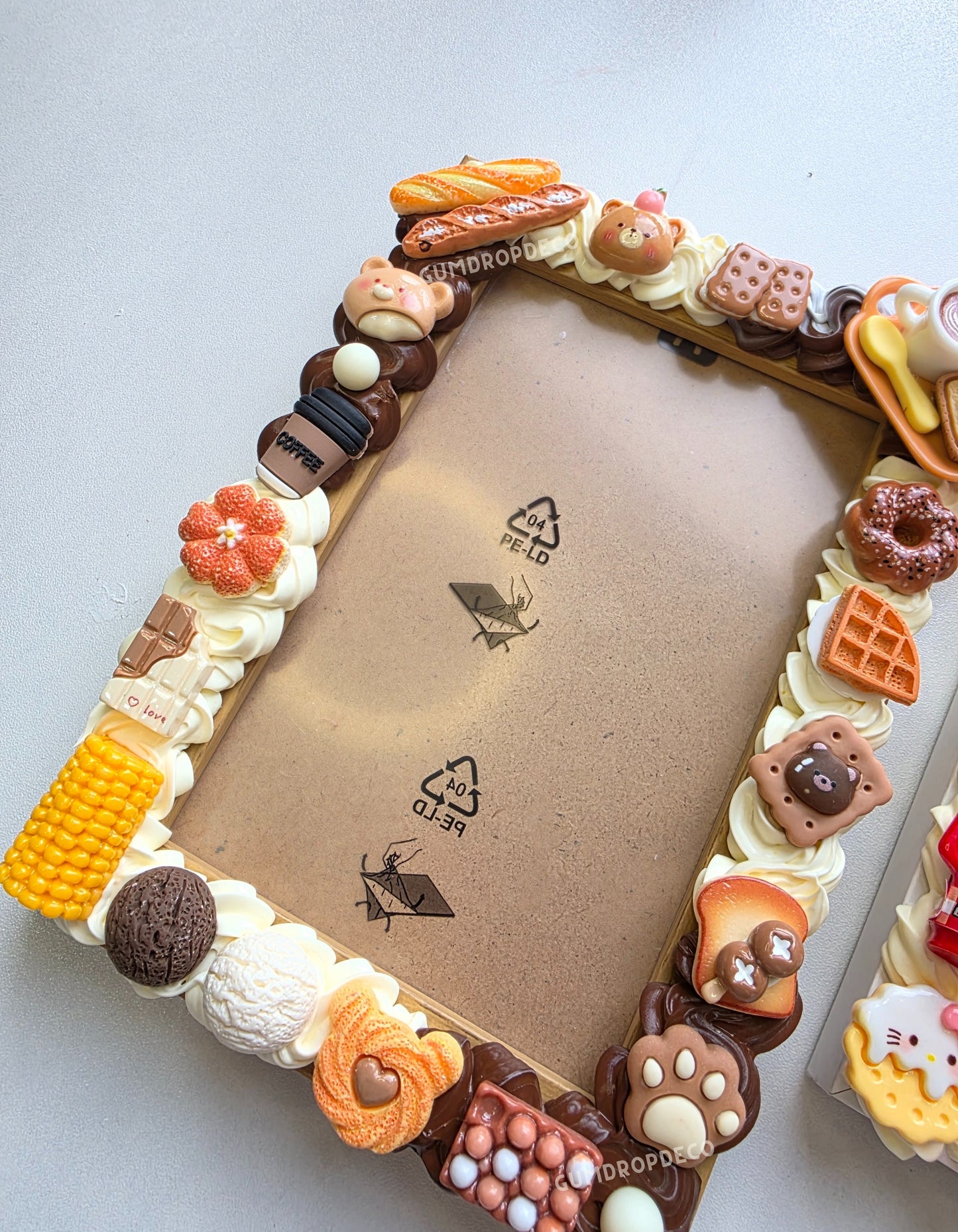 Handmade Decoden Frame with customizable colors and decorations, perfect for displaying your favorite memories.