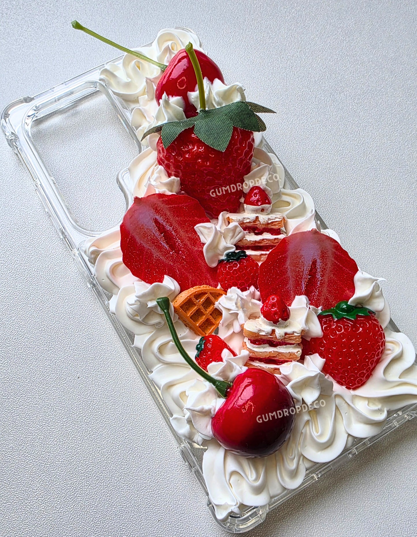 Phone case decorated with strawberries, whipped cream. Fruity Parfait decoden phone case with handmade whipped cream details & colorful fruit charms. Cute, protective & customizable design.