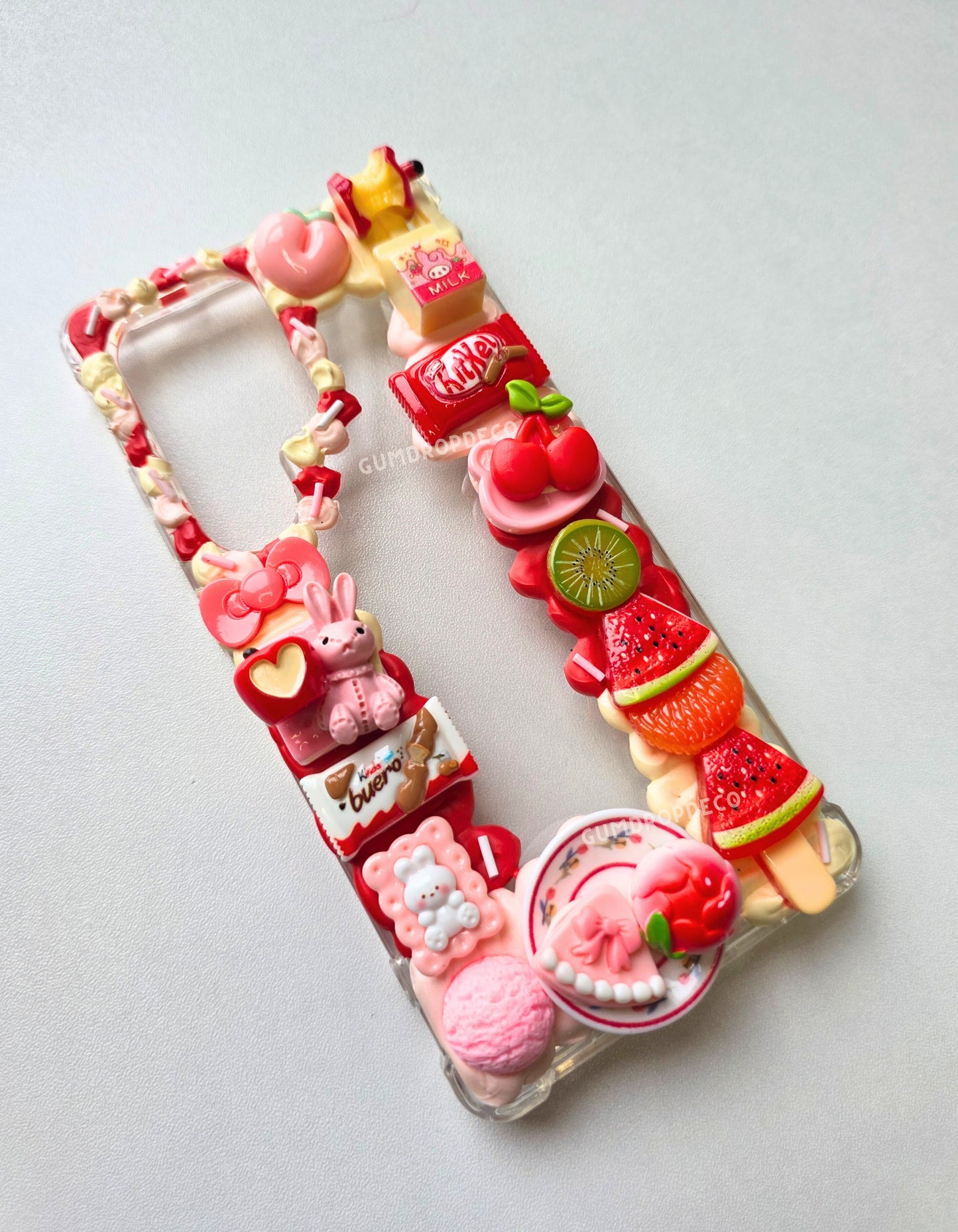 Custom decoden phone case with your choice of colors & characters. Handmade design, protective case & stylish charm for everyday use. fruit charms, pink and white decoden phone case