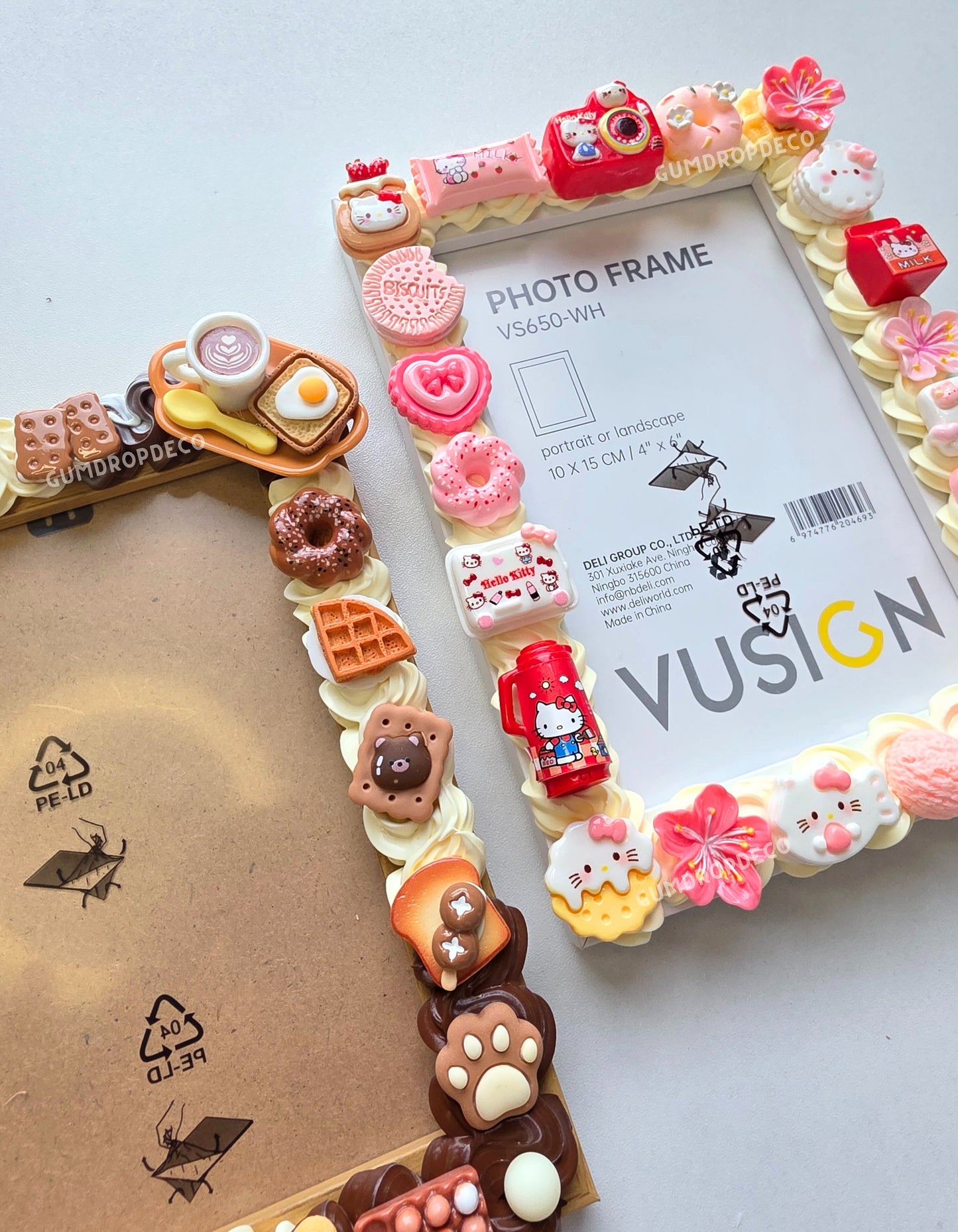 Custom Decoden Photo Frame – handcrafted 10 × 15 cm frame decorated with pastel whipped cream-style design and cute charms. Sanrio Hello Kitty and Food Bakery theme.
